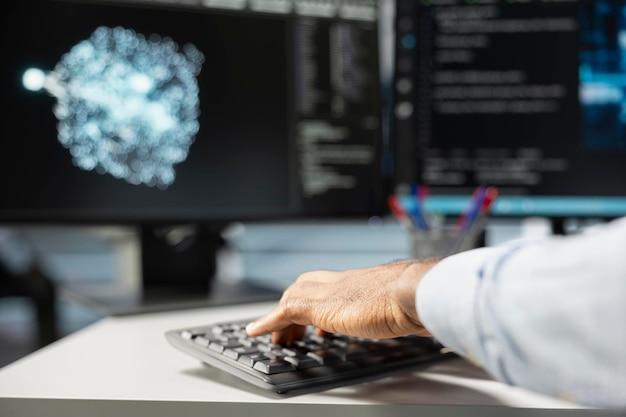 close up of data center engineer using ai visualization tools on pc